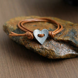 Amoura - Bracciale fatto a mano con simbolo del cuore