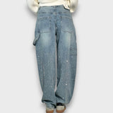 Nolene – Jeans con finitura scintillante e carattere urbano